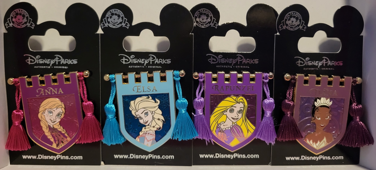 Frozen Anna and Elsa, Tangle Rapunzel, and Tiana Tapestry Disney Pins